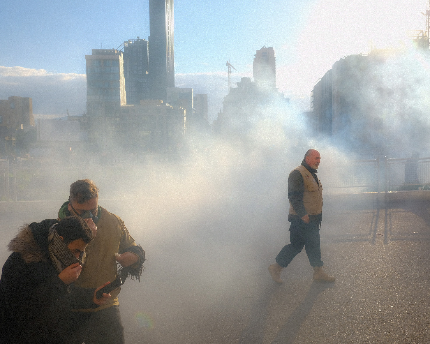  Protesters running from tear gas on the day of Parliament’s confidence vote.  11 February 2020. 